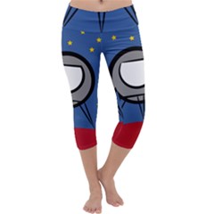 A Rocket Ship Sits On A Red Planet With Gold Stars In The Background Capri Yoga Leggings by Simbadda